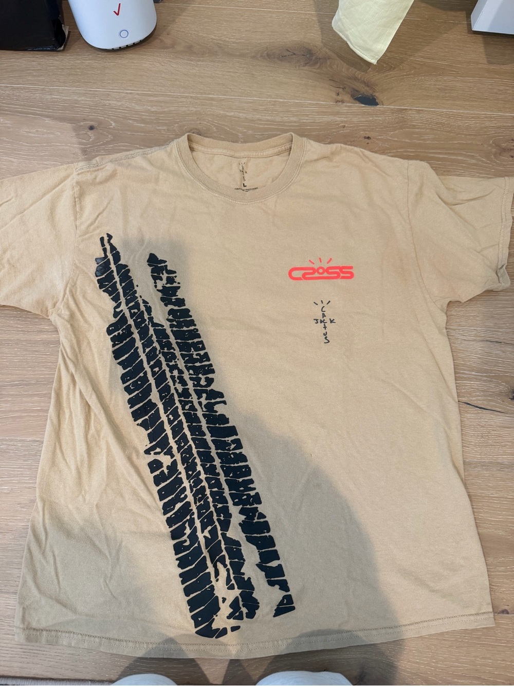 Cactus Jack by Travis Scott Beige Tee with Black Tire-Track and Red Logo